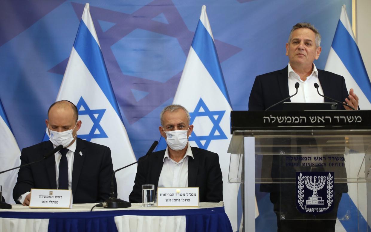  Israeli Prime Minister Naftali Bennett (L) and his Health Minister Nitzan Horowitz (R) during a press conference regarding the new corona variant in Tel Aviv, Israel, 26 November 2021. Bennett expressed concerns over the Covid variant B.1.1.529 emerging in South Africa which was also detected in Israel. Israeli Prime Minister Naftali Bennett, Tel Aviv, Israel - Shutterstock 