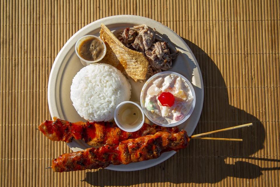 Toduken's OG Baboy skewers served with proot salad, pulled pork, dipping sauces and white rice at the Uptown Phoenix Famers Market.