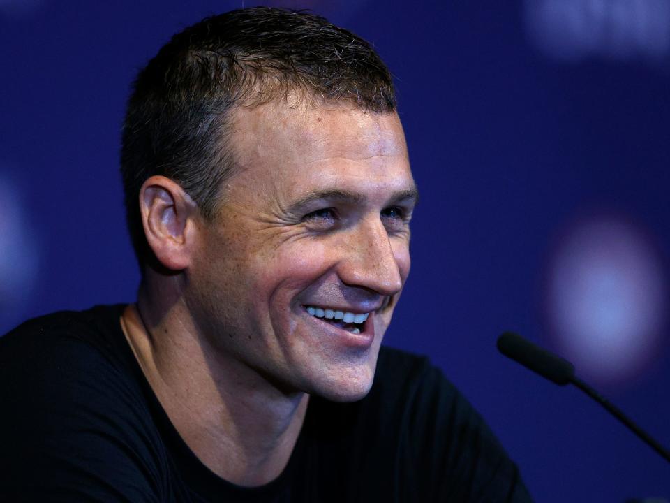 Ryan Lochte smiles while speaking at a press conference Olympic trials in 2021.