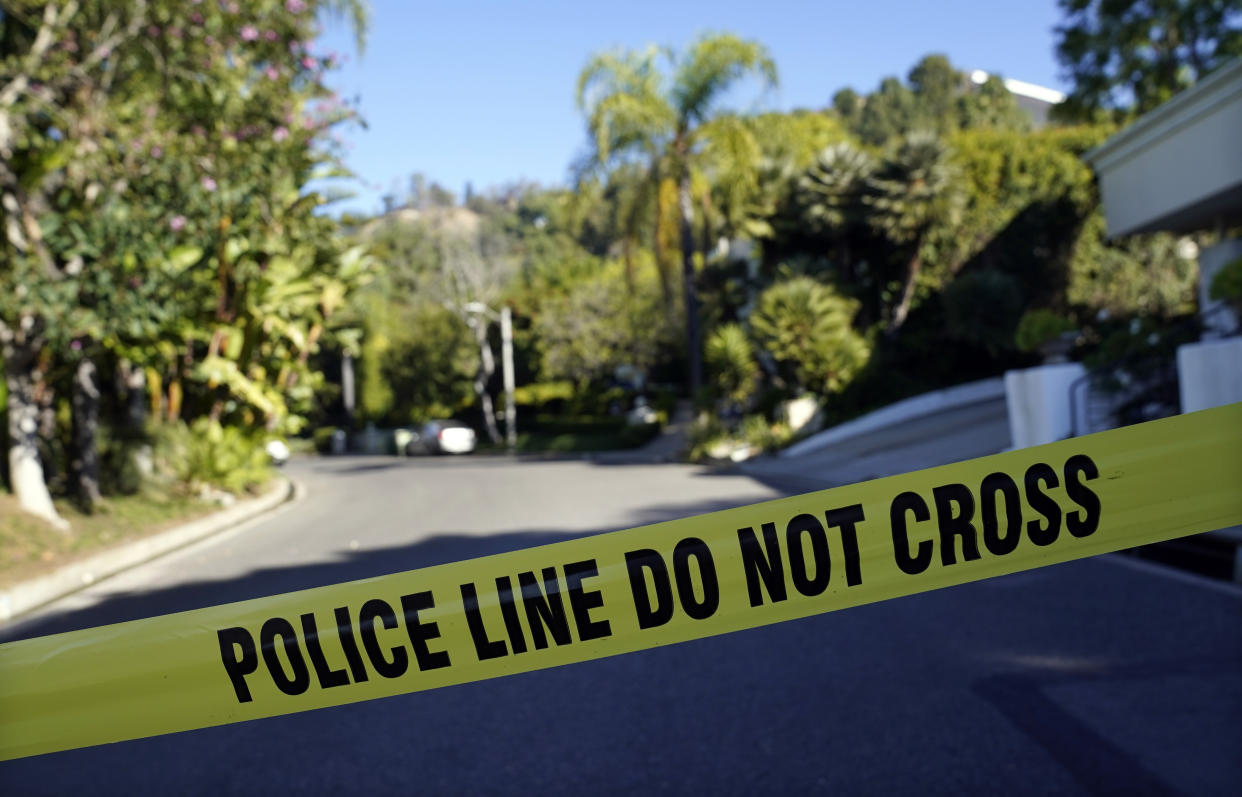 Police tape blocks the intersection of Maytor Place and Barrie Drive in the Trousdale Estates section of Beverly Hills, Calif., Wednesday, Dec. 1, 2021. Jacqueline Avant, the wife of music legend Clarence Avant, was fatally shot in the neighborhood early Wednesday. (AP Photo/Chris Pizzello)