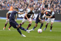 Manchester City's Riyad Mahrez takes a penalty during the English Premier League soccer match between West Ham United and Manchester City at London stadium in London, Sunday, May 15, 2022. (AP Photo/Kirsty Wigglesworth)