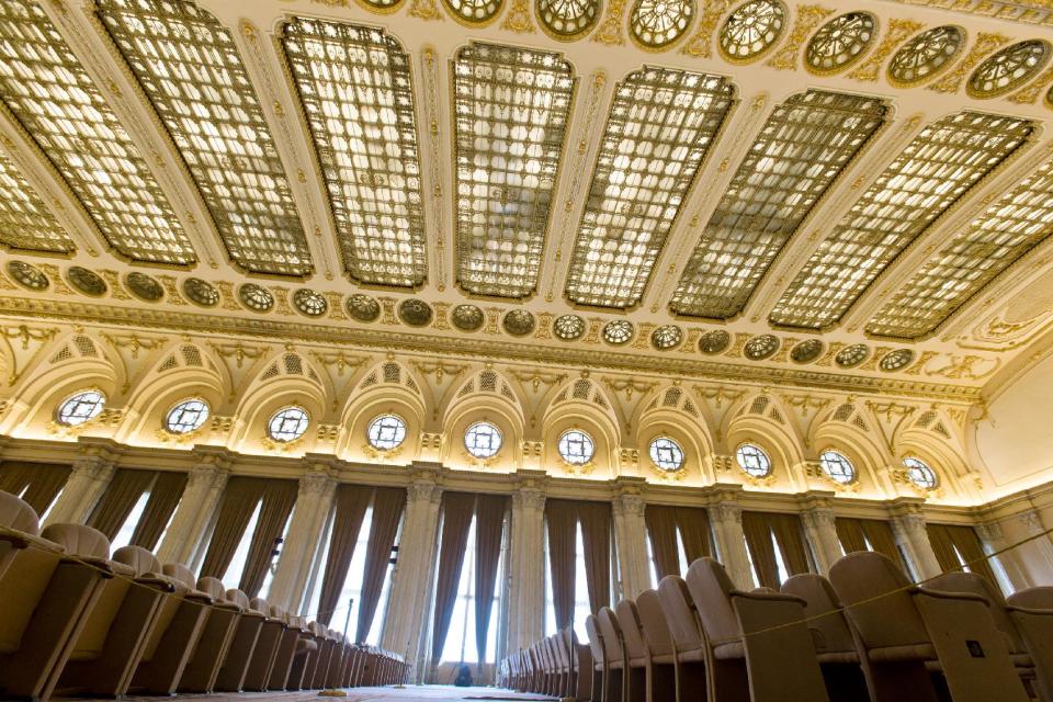 A picture taken on Dec. 12, 2012 shows a conference hall inside the Parliament Palace in Bucharest, Romania. Twenty-three years after communism collapsed, the Palace of the Parliament, a gargantuan Stalinist symbol and the most concrete legacy of ex-dictator Nicolae Ceausescu, has emerged as an unlikely pillar of Romania's nascent democracy. And while it remains one of the most controversial projects of Ceausescu's 25-year rule, albeit one that has gradually found a place in the nation's psyche, it's also now a tourist attraction, visited by tens of thousands of Romanians and foreigners every year. (AP Photo/Vadim Ghirda)