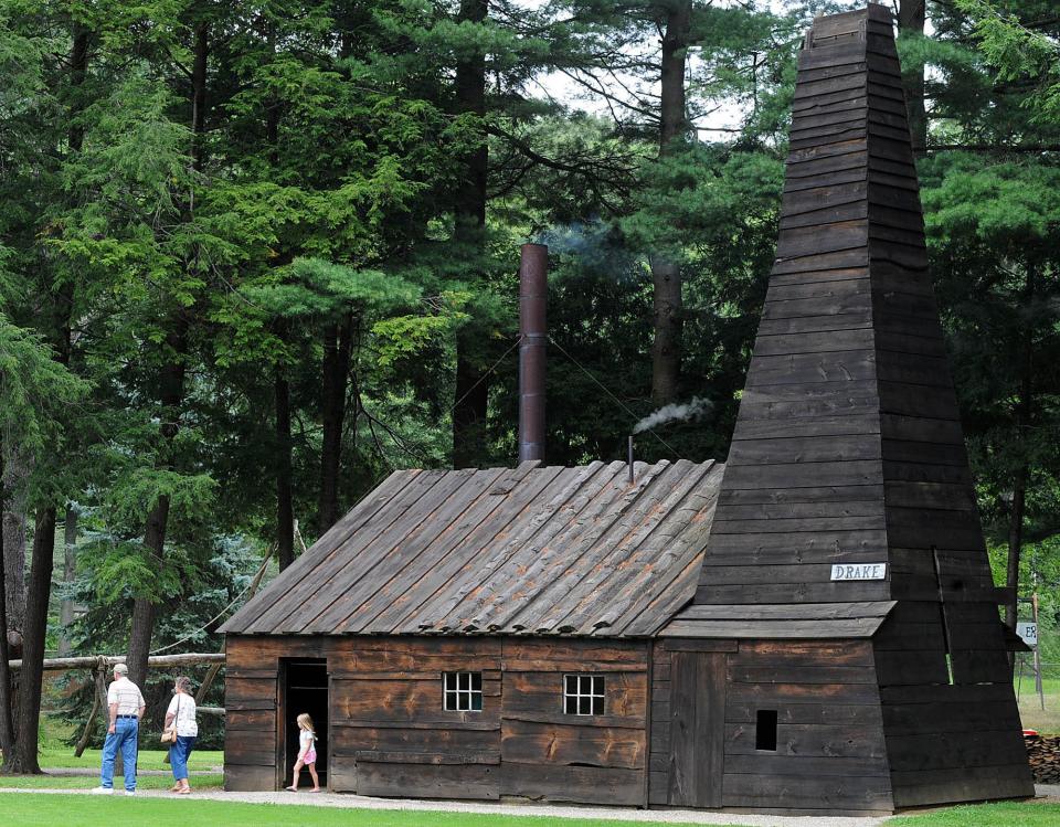 In this file photo, visitors leave the replica of Col. Edwin Drake's first oil well on the grounds of the Drake Well Museum near Titusville on August 23, 2021. The site south of Erie County marks the birthplace of the modern oil industry. Retired engineer William R. Miller suggests we promote and incentivize the use of Pennsylvania crude oil for industrial lubricants, rather than diesel fuel and gasoline.