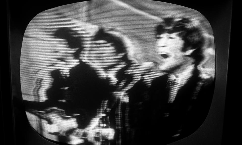 NEW YORK - 1964: The Beatles perform on the Ed Sullivan Show, shot on a TV screen during the original broadcast on February 9, 1964, in New York City, New York. (Photo by David Attie/Getty Images)