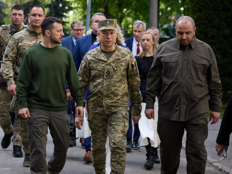 Ukrainian President Volodymyr Zelensky, Army chief Oleksandr Syrski and defence minister Rustem Umerov walk together in Kyiv last month (via REUTERS)