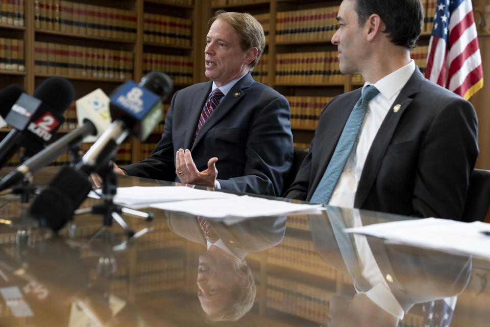 Oregon Senate Republican Leader Sen. Tim Knopp speaks as Democratic Senate President Rob Wagner listens during a news conference as part of a 2024 legislative preview at the State Library on Wednesday, Jan. 31, 2024, in Salem, Ore. The Oregon Supreme Court said Thursday, Feb. 1, 2024, that 10 Republican state senators who staged a record-long walkout last year to stall bills on abortion, transgender health care and gun rights cannot run for reelection. (AP Photo/Jenny Kane)