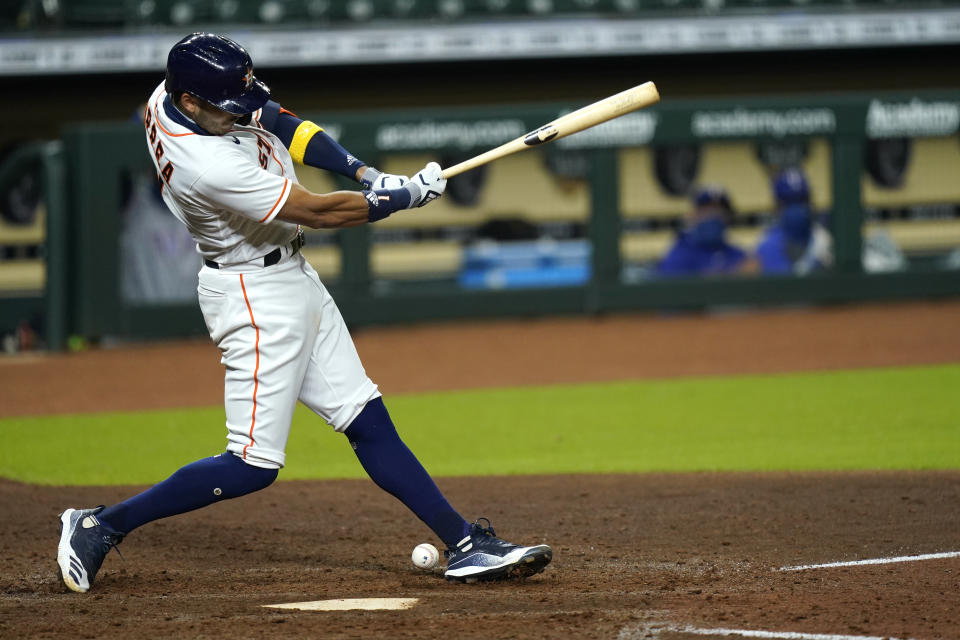 Houston Astros' Carlos Correa fouls a pitch off his leg during the sixth inning of a baseball game against the Texas Rangers Tuesday, Sept. 15, 2020, in Houston. Correa left the game after the injury. (AP Photo/David J. Phillip)