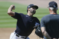 Detroit Tigers pitcher Michael Fulmer is observed by pitching coach Rick Anderson, right, during baseball training camp at Comerica Park, Friday, July 3, 2020, in Detroit. (AP Photo/Duane Burleson)