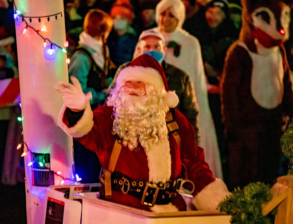 Santa greets families gathered at State and Main during Doylestown Borough's 107th Annual Tree Lighting Nov. 26. [MARION CALLAHAN / PHOTOJOURNALIST]