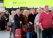 Tourists at Gran Canaria airport wait to return to their countries after closure of hotels