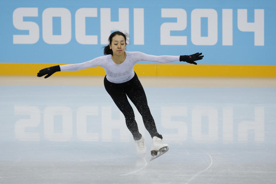 Mao Asada of Japan skates during a practice session at the figure stating practice rink at the 2014 Winter Olympics, Tuesday, Feb. 18, 2014, in Sochi, Russia. (AP Photo/Bernat Armangue)