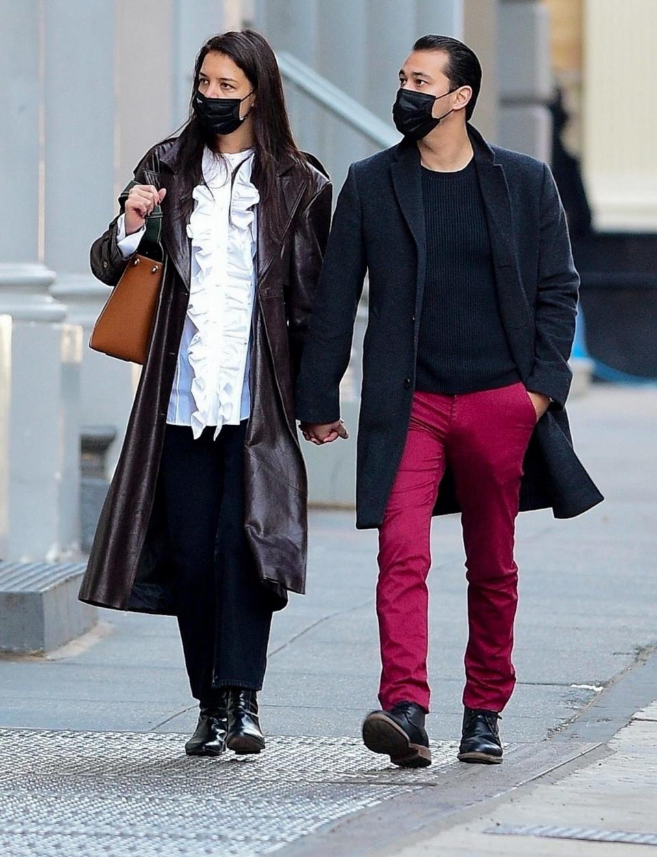 <p>Katie Holmes and boyfriend Emilio Vitolo Jr. hold hands as they go shopping in N.Y.C. on Thursday. </p>
