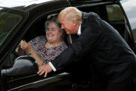 <p>President Donald Trump poses for a selfie with an unidentified resident waiting in a relief supply drive-thru during a visit with flood survivors and volunteers in the aftermath of Hurricane Harvey in Houston, Texas, Sept. 2, 2017. (Photo: Kevin Lamarque/Reuters) </p>