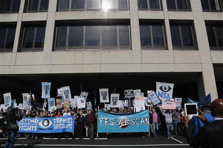 Demonstarators march in the "Stop Watching Us: A Rally Against Mass Surveillance" near the U.S. Capitol in Washington, October 26, 2013. REUTERS/Jonathan Ernst