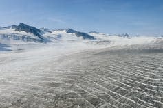 head of Shamrock glacier, with bare mountain peaks behind it