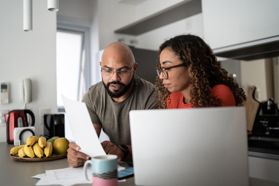 Couple doing home finances together at home