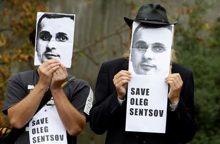 FILE PHOTO: Demonstrators attend a protest rally demanding the release of Ukrainian film director Oleg Sentsov, in Prague