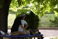 Olympic champion Marcell Jacobs receives a massage in a training center in Rome, Monday, May 23, 2022. This year could be more memorable for Jacobs than his breakout 2021 when he sprinted from virtual unknown to Olympic 100-meter champion then added another surprising gold at the Tokyo Games with Italy's 4x100-meter relay team. Jacobs tells The Associated Press that "winning these next two big events would mean winning everything there is to win in athletics."(AP Photo/Alessandra Tarantino)