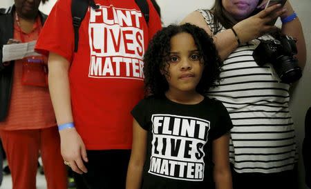 Mari Copeny, 8, of Flint, Michigan, waits in line to enter a hearing room where Michigan Governor Rick Snyder (R) and EPA Administrator Gina McCarthy will testify before a House Oversight and government Reform hearing on "Examining Federal Administration of the Safe Drinking Water Act in Flint, Michigan, Part III" on Capitol Hill in Washington in this March 17, 2016, file photo. REUTERS/Kevin Lamarque/Files