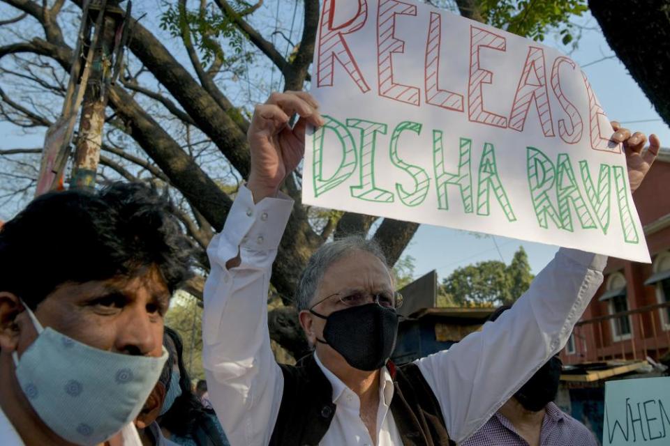 Historian, author and activist Ramachandra Guha (right) protests against the arrest of the activist Disha Ravi by Delhi police