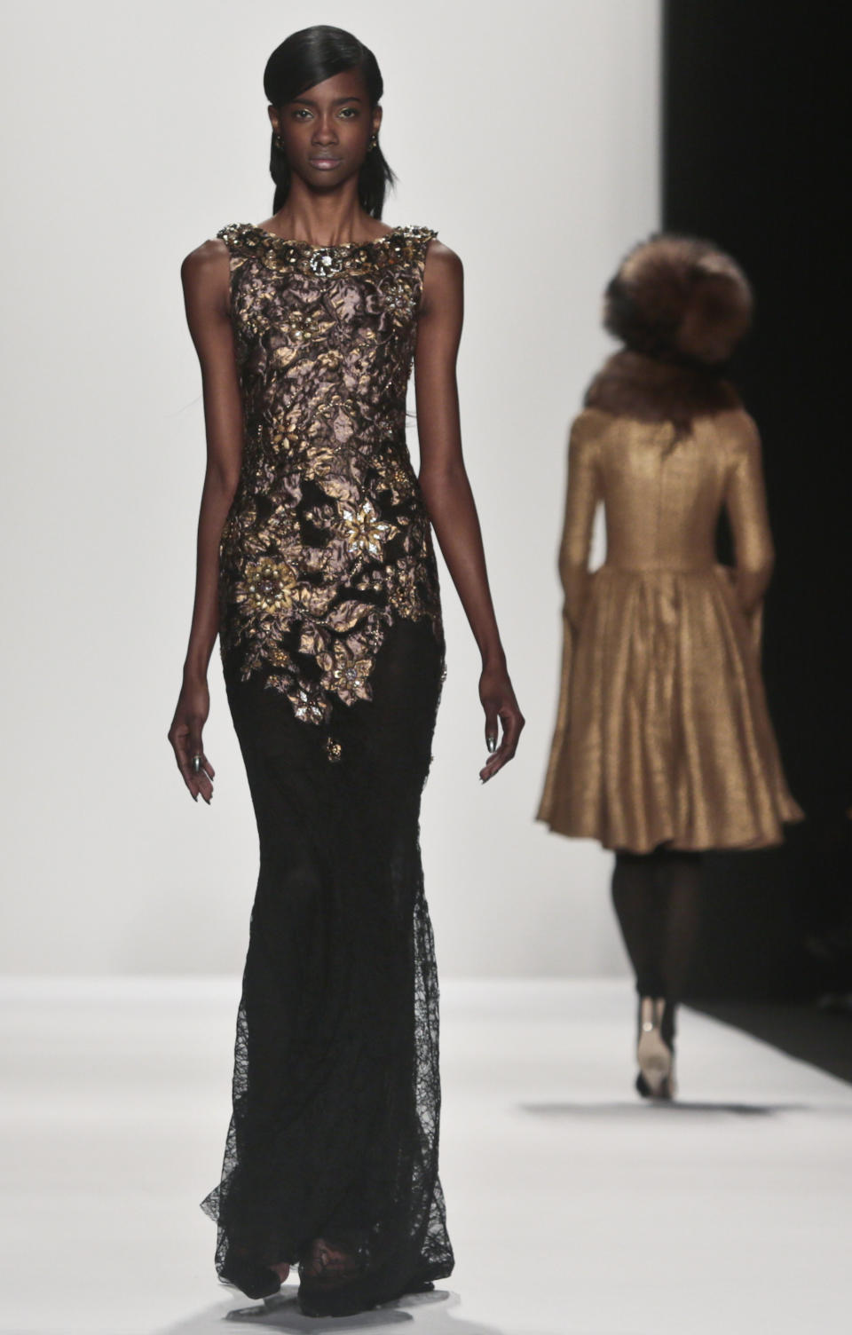 Fashion from the Badgley Mischka Fall 2014 collection is modeled during New York Fashion Week on Tuesday Feb. 11, 2014. (AP Photo/Bebeto Matthews)