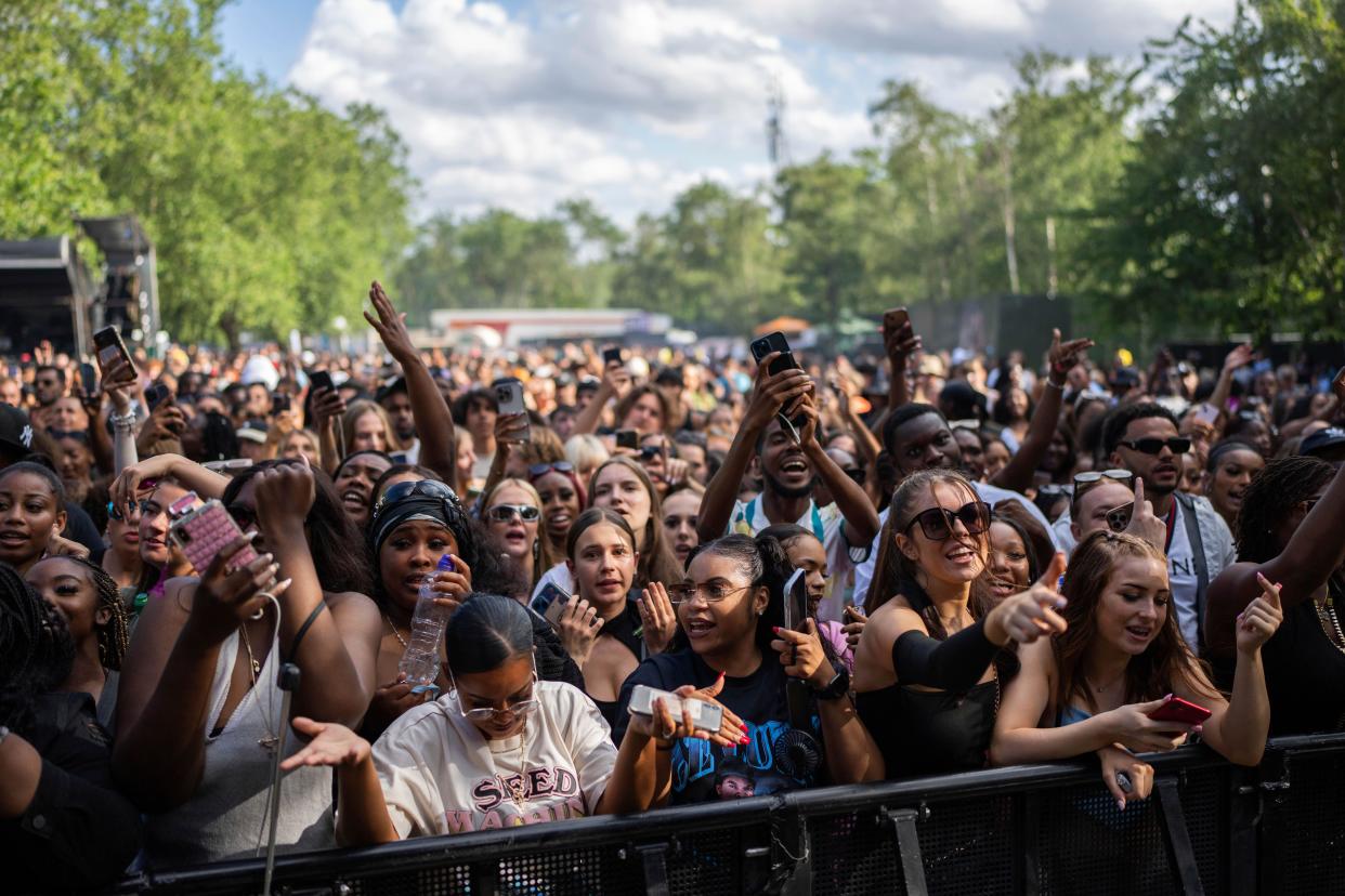 Festival goers at the Wireless Music Festival, in Finsbury Park, London, Sunday, July 9, 2023. (Scott Garfitt/Invision/AP)