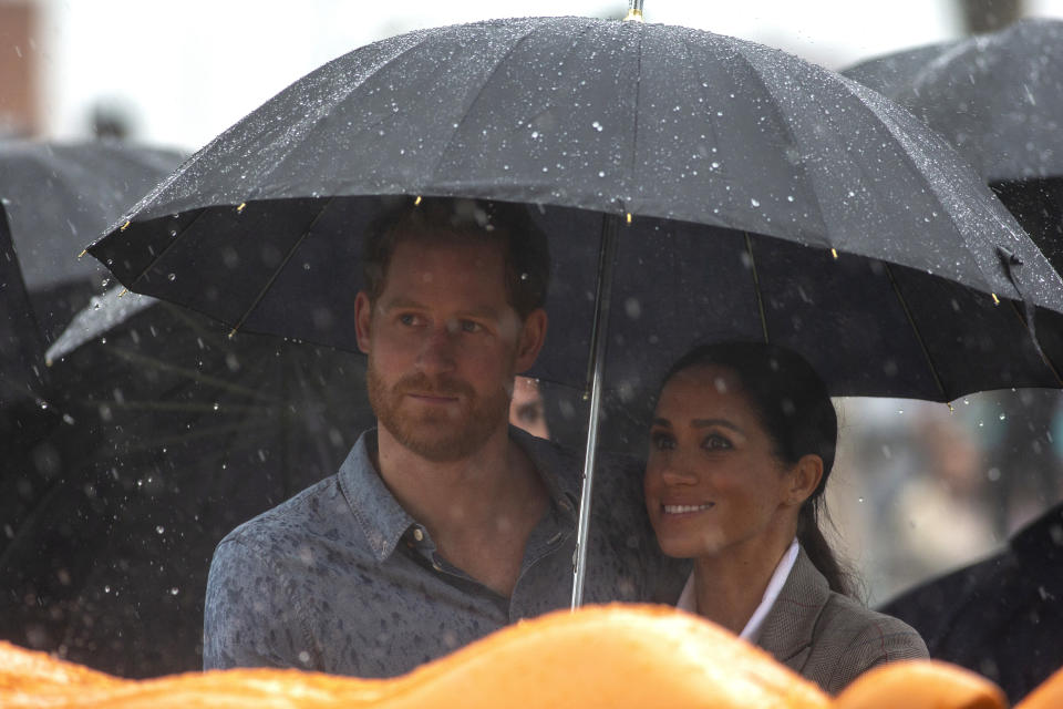 Britain's Prince Harry and Meghan, Duchess of Sussex attend a community picnic at Victoria Park in Dubbo, Australia, Wednesday, Oct. 17, 2018. Prince Harry and his wife Meghan are on day two of their 16-day tour of Australia and the South Pacific. (Ian Vogler/Pool via AP)