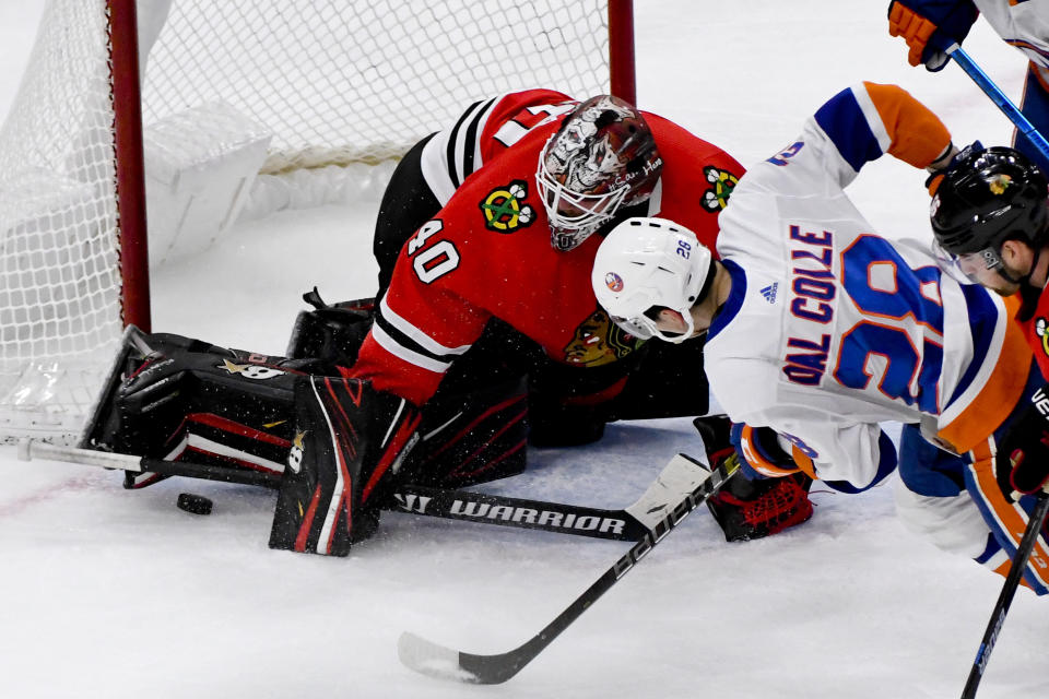 Chicago Blackhawks goaltender Robin Lehner (40) defends against New York Islanders left wing Michael Dal Colle (28) during the second period of an NHL hockey game Friday, Dec. 27, 2019, in Chicago. (AP Photo/Matt Marton)