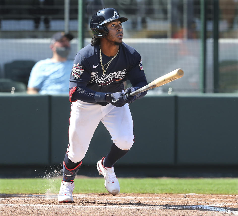 Atlanta Braves' Ozzie Albies hits a solo homerun against the Baltimore Orioles during the fourth inning of a spring baseball game at CoolToday Park in North Port, Fla., Wednesday, March 3, 2021. (Curtis Compton/Atlanta Journal-Constitution via AP)