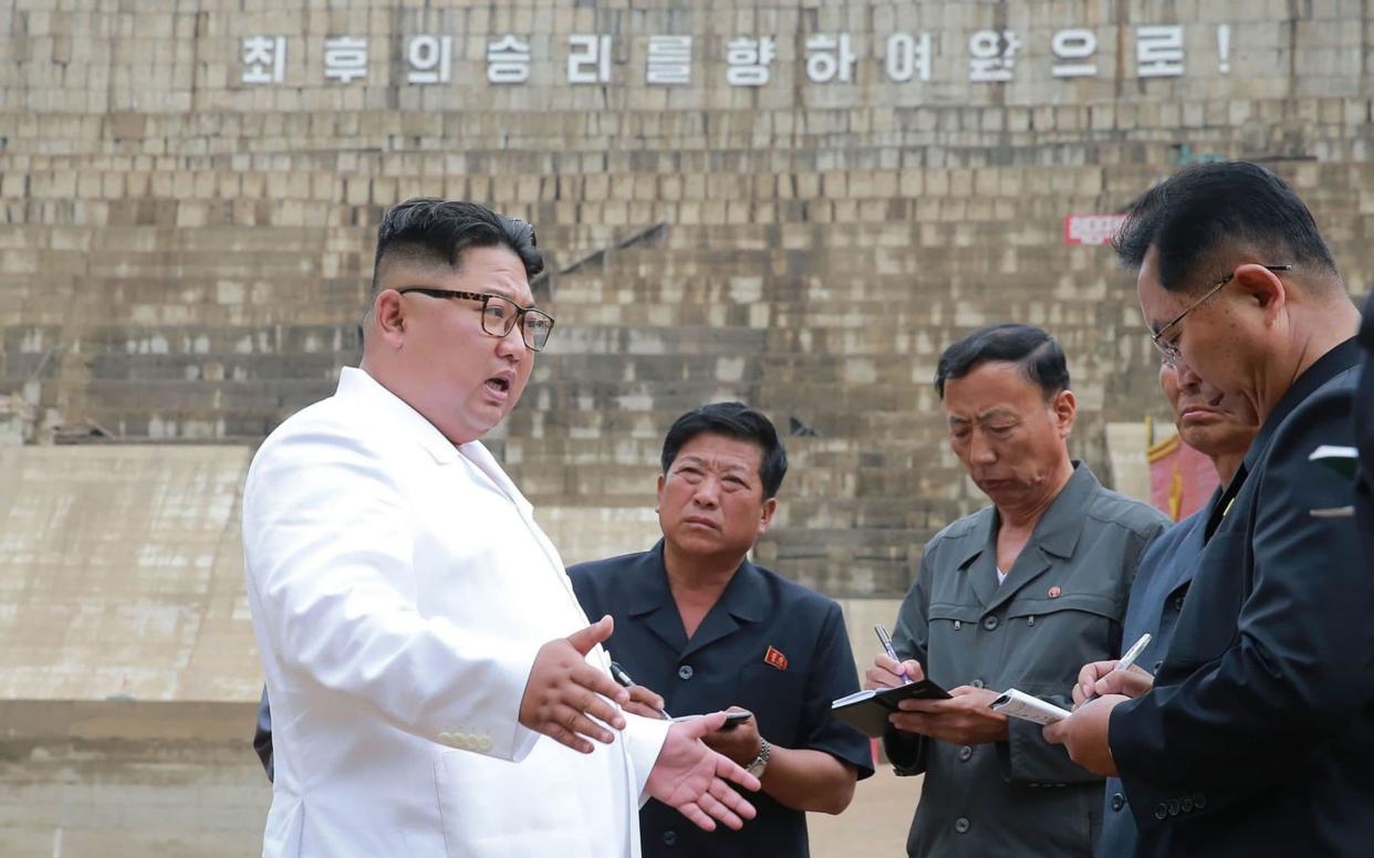 Kim had harsh words for workers at a delayed electrical power plant at Orang river in North Hamgyong Province - AFP