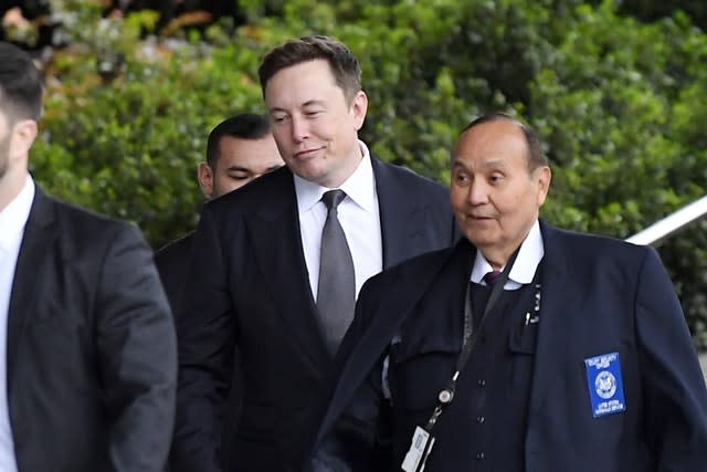 Tesla CEO Elon Musk, second from righ