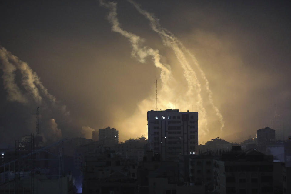 Smoke and explosions caused by Israeli bombardment are seen on the horizon in northern Gaza, Saturday, Oct. 28, 2023. (AP Photo/Abed Khaled)