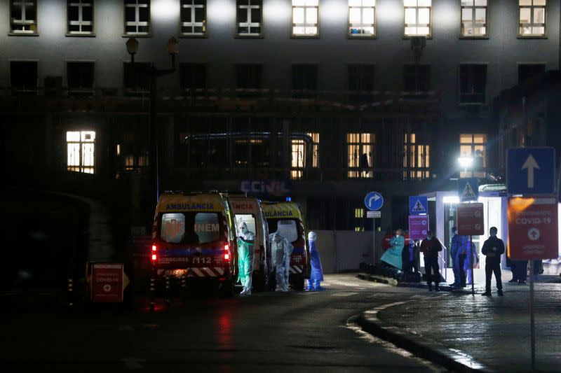 Ambulances with COVID-19 patients are seen waiting in Santa Maria hospital, as COVID-19 patients are being transferred from another hospital after a oxygen supply malfunction, amid the coronavirus disease (COVID-19) pandemic in Lisbon