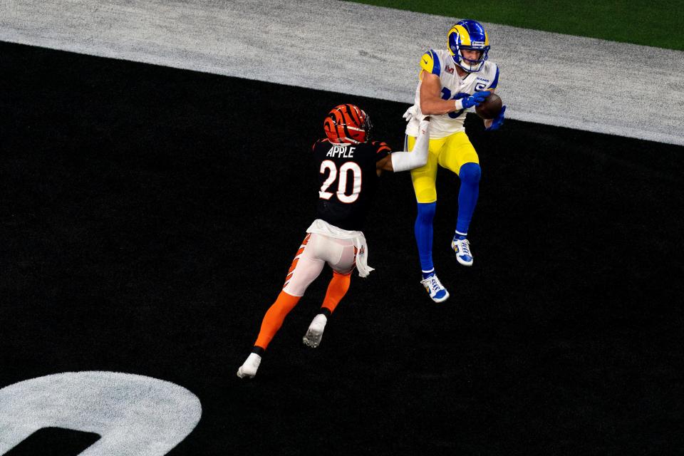 Los Angeles Rams wide receiver Cooper Kupp (10) scores the go ahead touchdown as Cincinnati Bengals cornerback Eli Apple (20) defends in the fourth quarter during Super Bowl 56, Sunday, Feb. 13, 2022, at SoFi Stadium in Inglewood, Calif.