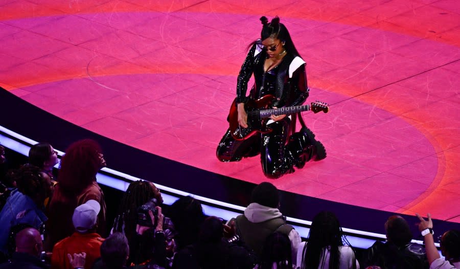 US singer H.E.R. performs during Apple Music halftime show of Super Bowl LVIII between the Kansas City Chiefs and the San Francisco 49ers at Allegiant Stadium in Las Vegas, Nevada, February 11, 2024. (Photo by Patrick T. Fallon / AFP) (Photo by PATRICK T. FALLON/AFP via Getty Images)