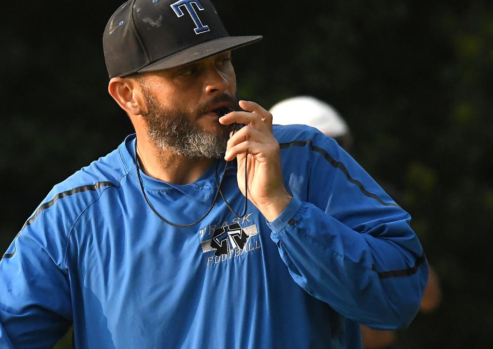 Trask’s Coach Lawrence Ches talks to his team as they go through practice drills Wednesday Aug. 2, 2023 in Rocky Point, N.C. Area teams began the 2023 season this week by kicking off practices throughout the day. KEN BLEVINS/STARNEWS