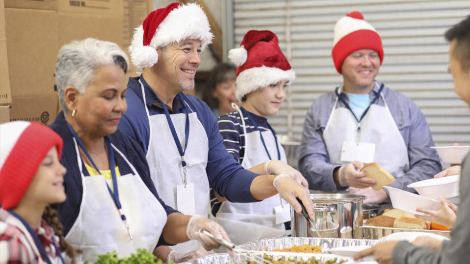 volunteers serving Christmas dinner at a shelter