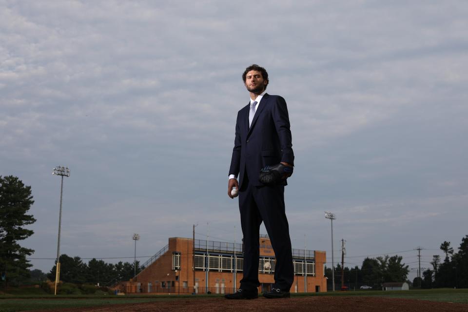 Michael Schwimer posing during photo shoot on baseball field at Bullis School.