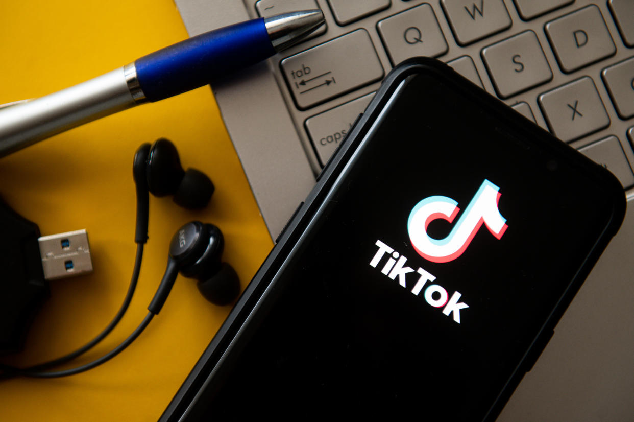 In this photo illustration a TikTok logo seen displayed on a smartphone. 