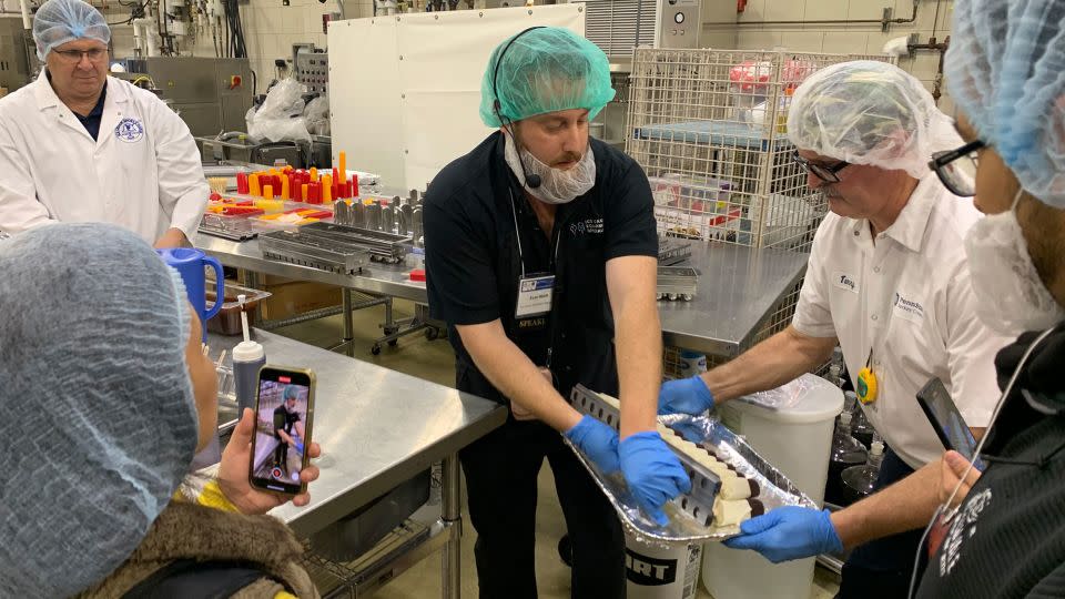 Ice cream novelties are created during a freezing class taught by Ice Cream Equipment Specialists Evan Waldt (center), Penn State’s Ph.D. Professor and Head of Food Science Dr. Bob Roberts (left) and Penn State's Dairy Products Processor manager Terry Grove (right). - Amanda Hobor/CNN