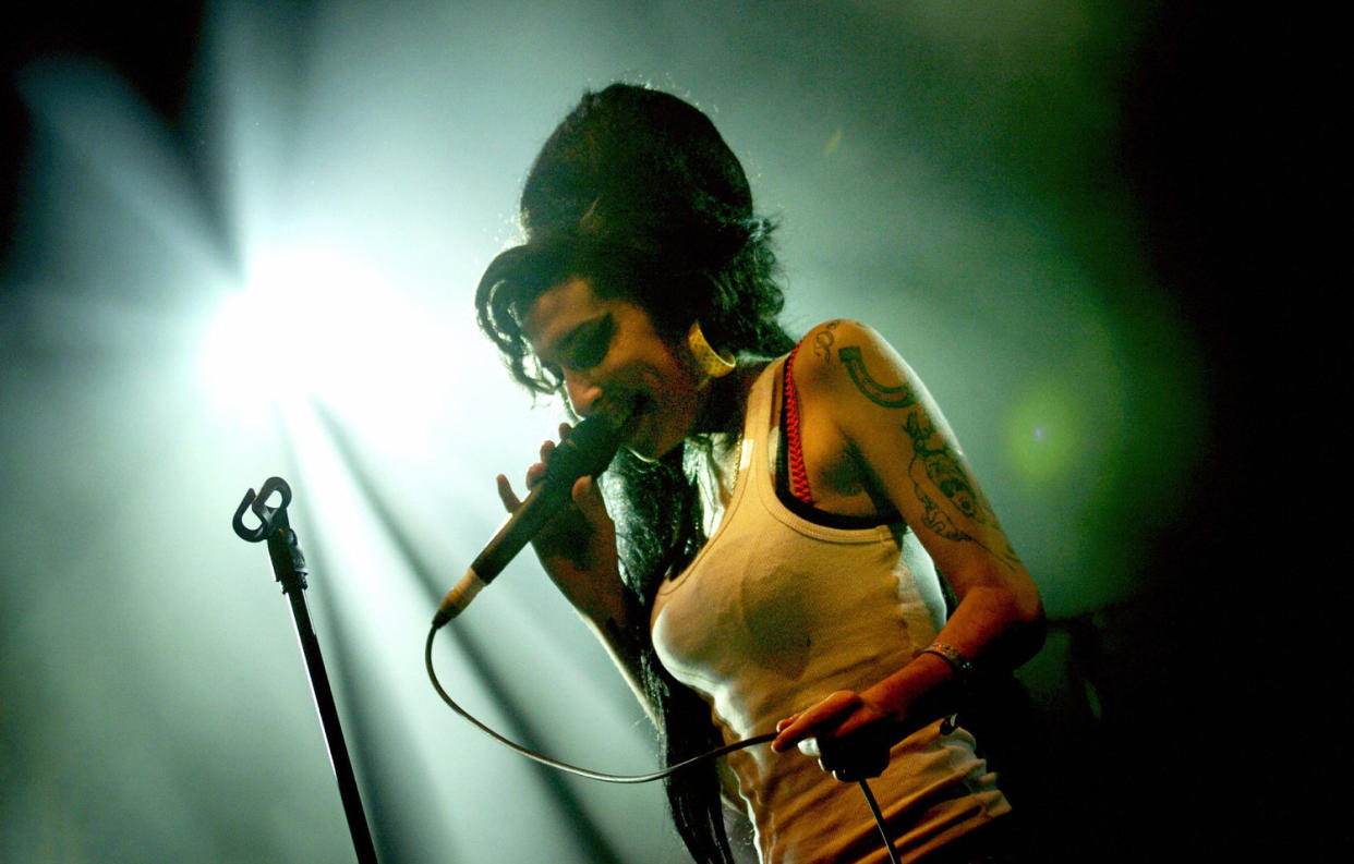 Amy Winehouse on stage at the Eurockeennes Music Festival in 2007. (Jeff Pachoud / Getty Images)