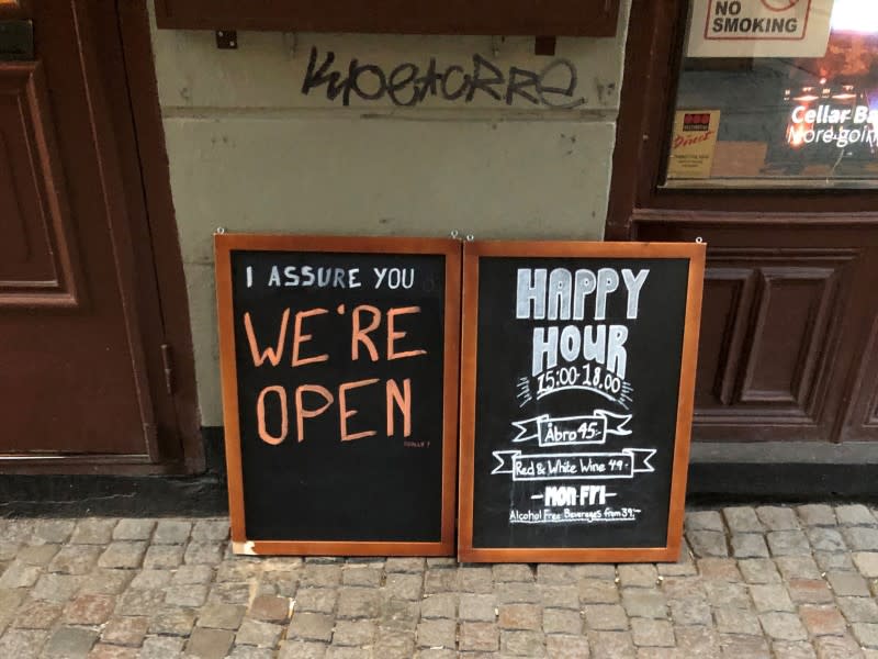 Sign assures people that bar is open during coronavirus outbreak in Stockholm