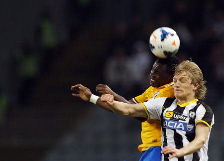 Juventus' Kwadwo Asamoah (L) jumps for the ball with Udinese's Dusan Basta during their Italian Serie A soccer match at the Friuli stadium in Udine April 14, 2014. REUTERS/Alessandro Garofalo