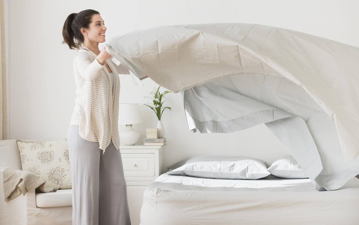As a general guideline, before the coronavirus pandemic, it was a good idea to wash bed sheets once a week. Experts suggest doubling that frequency now. (Photo: Tetra Images via Getty Images)