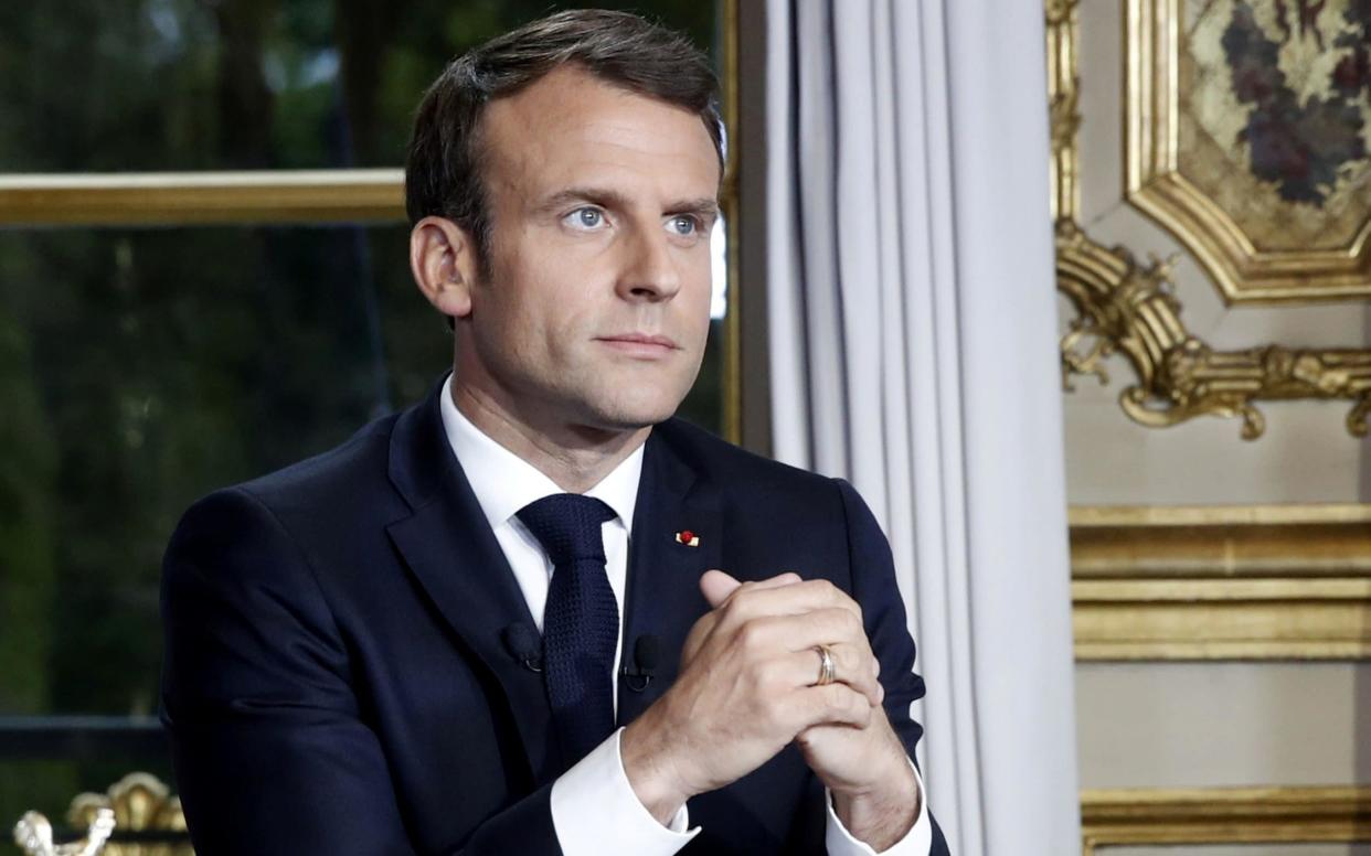 French President Emmanuel Macron addresses the French nation following a massive fire at Notre Dame Cathedral, at the Elysee Palace in Paris - REUTERS