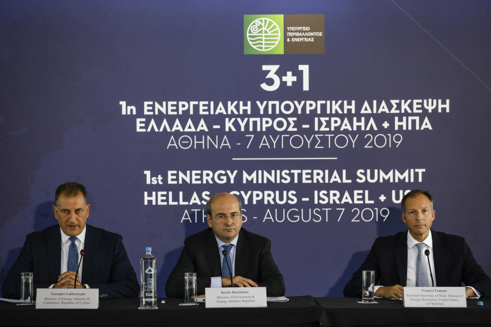 Greek Minister of Environment and Energy Kostas Hatzidakis, center, U.S. Assistant Secretary of State of Energy Francis Fannon, right, and Cyprus' Energy Minister Georgios Lakkotrypis take part in a summit in Athens, on Wednesday, Aug. 7, 2019. Ministers of Greece , Cyprus Israel and US participated Wednesday in the first Energy Ministerial Summit. (AP Photo/Petros Giannakouris)