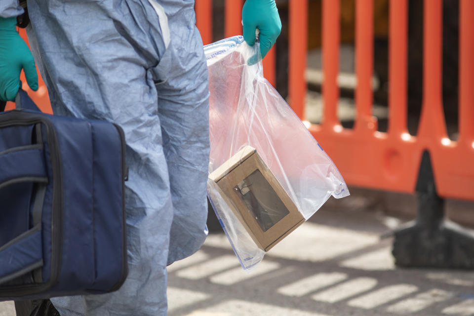 LONDON, ENGLAND - AUGUST 17: A forensic officer carries a knife from the scene this morning after an incident in which four boys were stabbed on August 17, 2018 in London, England. One of the boys is in critical condition and six people have been arrested. (Photo by Dan Kitwood/Getty Images)