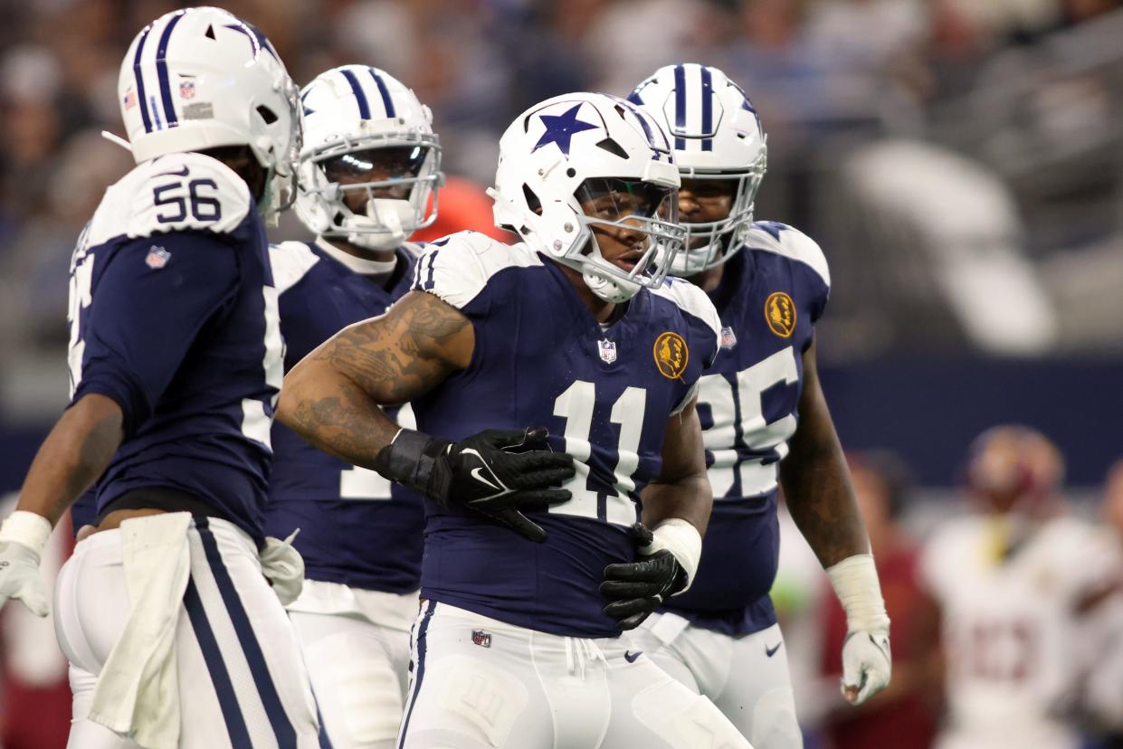 Week 12: Dallas Cowboys linebacker Micah Parsons (11) celebrates a sack of Washington Commanders quarterback Sam Howell during a 45-10 win in the Thanksgiving Day game at AT&T Stadium. The Cowboys wore throwback uniforms, which were inspired by the original look of the team in the early 1960s.