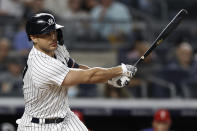 New York Yankees designated hitter Giancarlo Stanton hits an RBI single against the Philadelphia Phillies during the seventh inning of a baseball game Wednesday, July 21, 2021, in New York. (AP Photo/Adam Hunger)