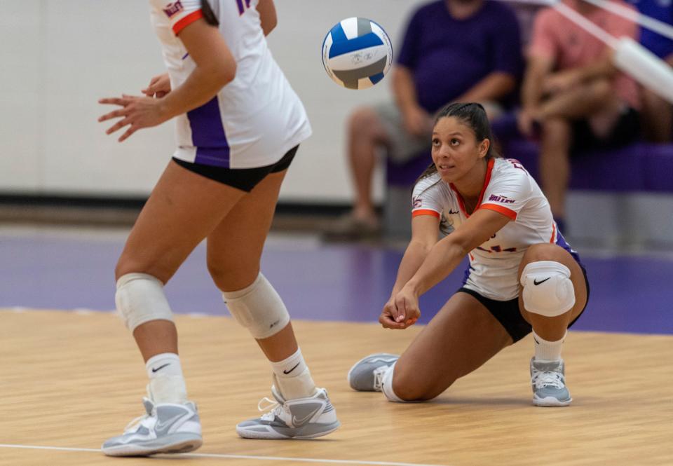 Evansville’s Alondra Vazquez (14) digs as the University of Evansville Purple Aces play the University of Southern Indiana Screaming Eagles at Meeks Family Fieldhouse in Evansville, Ind., Tuesday evening, Aug. 30, 2022. 